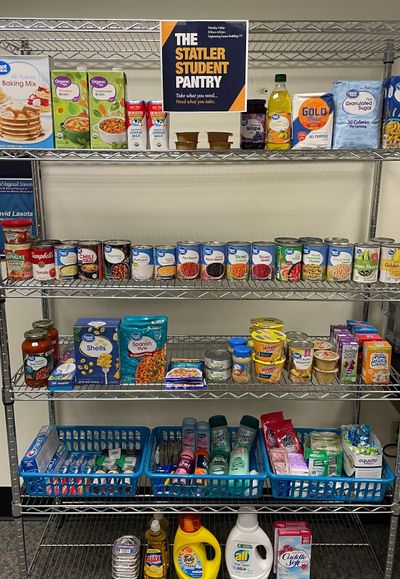 Shelves full of food and household items at the Statler Student Pantry